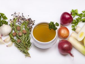 Soup bowl of vegetable stock and ingredients --- Image by © Foodcollection/the food passionates/Corbis